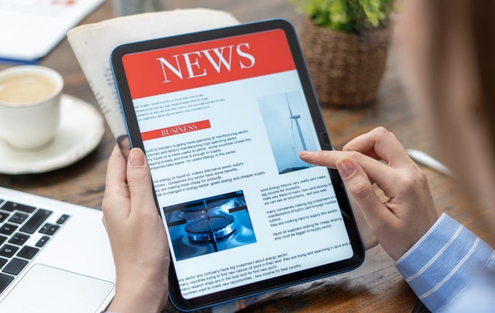 business woman using tablet pc for reading news